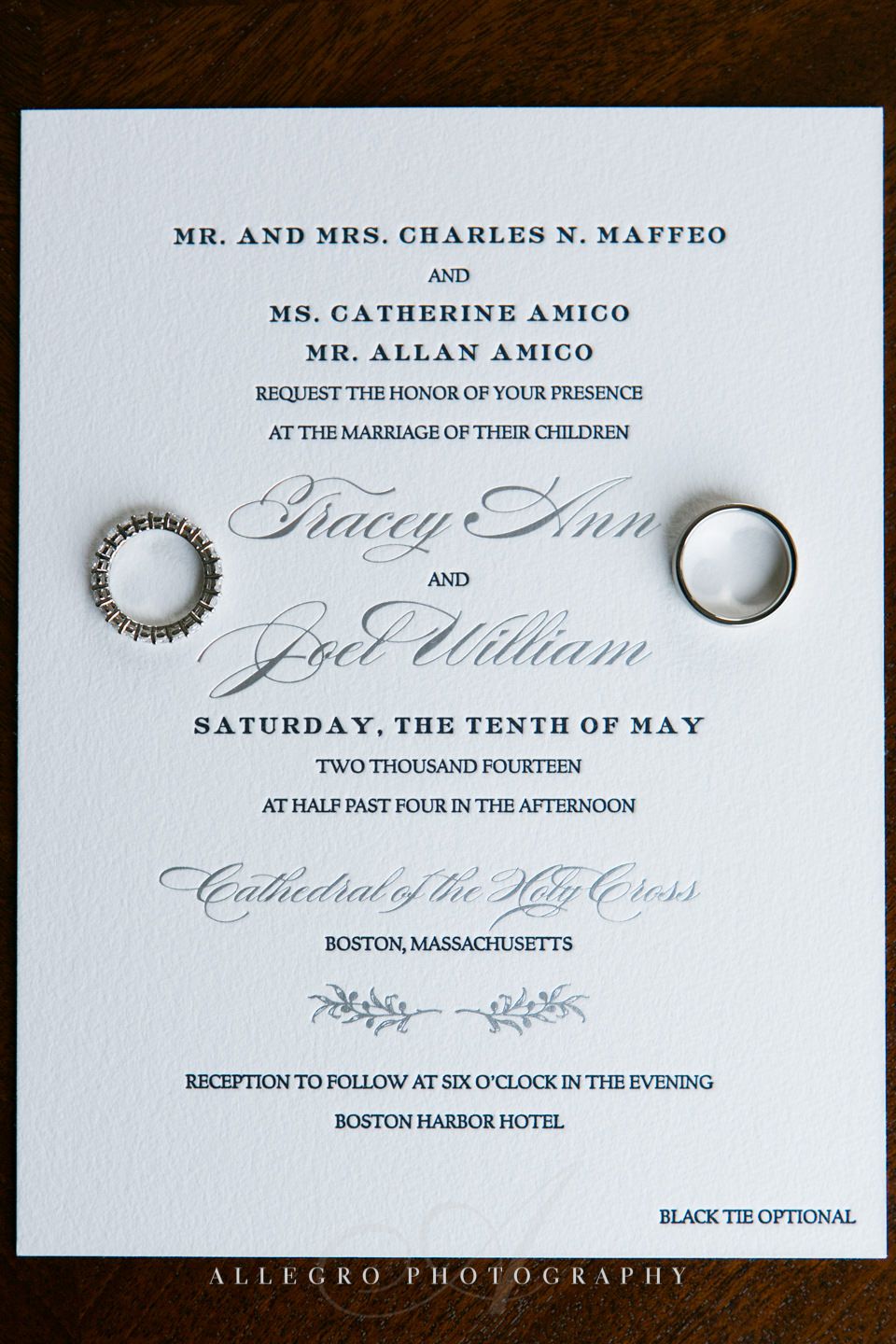 invitation with wedding ring- ring shot- photo by allegro photography