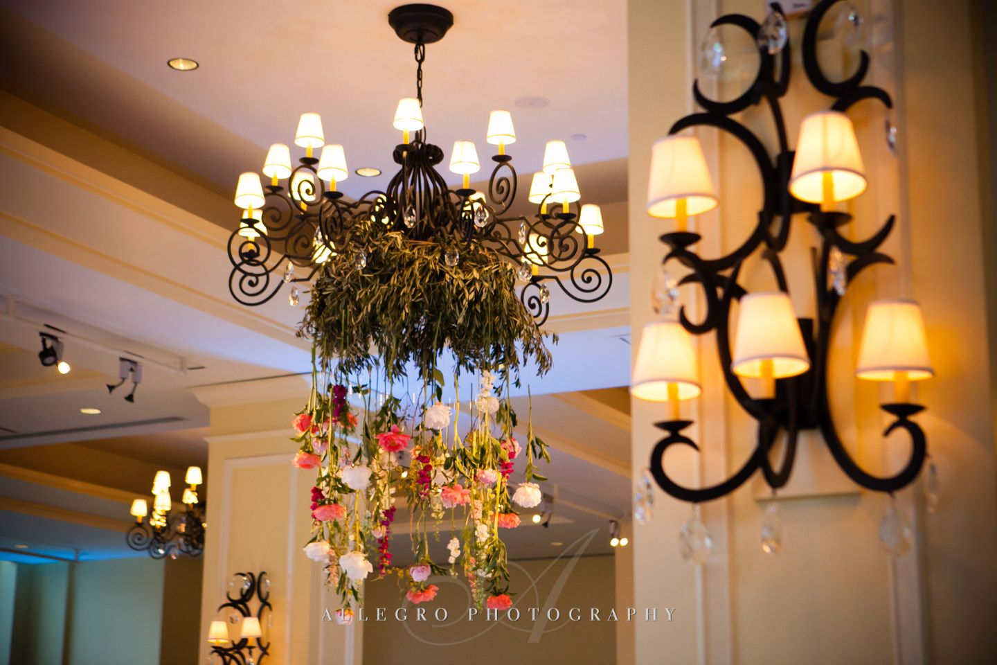 floral chandelier with pink white green peonies dripping down- photo by allegro photography
