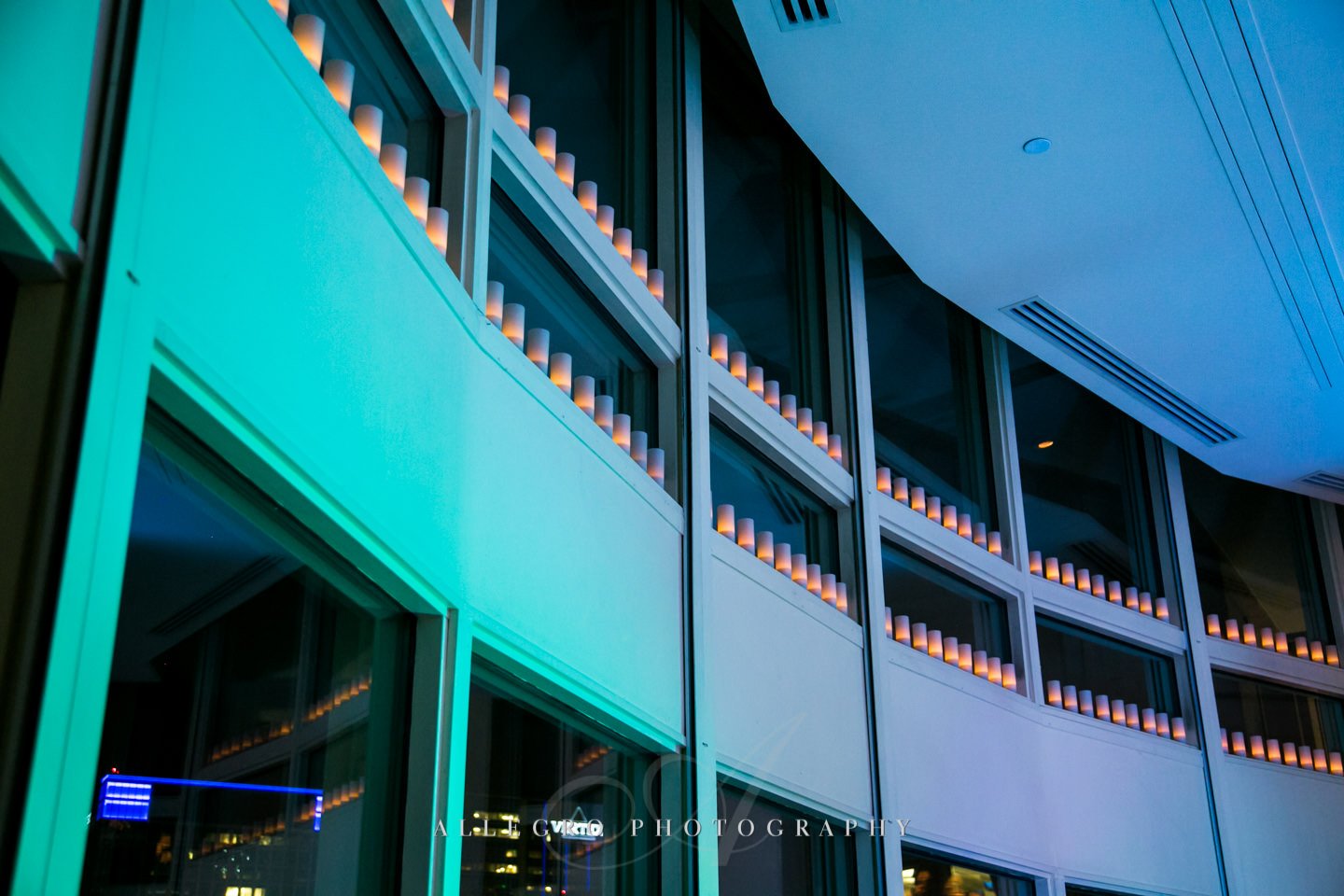 candles along the windows and cool uplights at boston harbor hotel - photo by allegro photography
