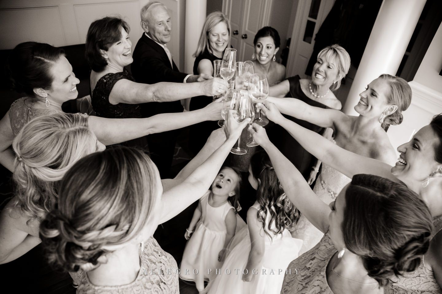 toast with flower girls in the mix - photo by Allegro Photography