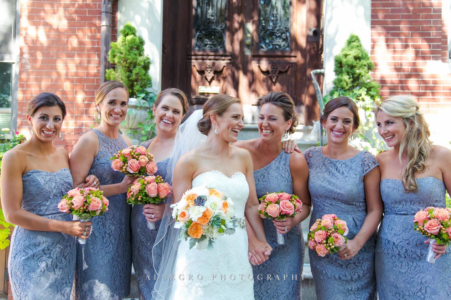 bride and bridesmaids portrait in front of home - photo by Allegro Photography