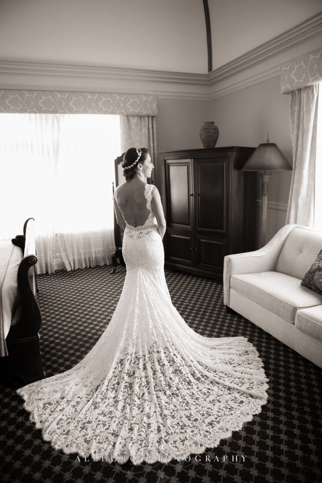 the bride is ready with her lace wedding gown and train- portrait -photo by Allegro Photography