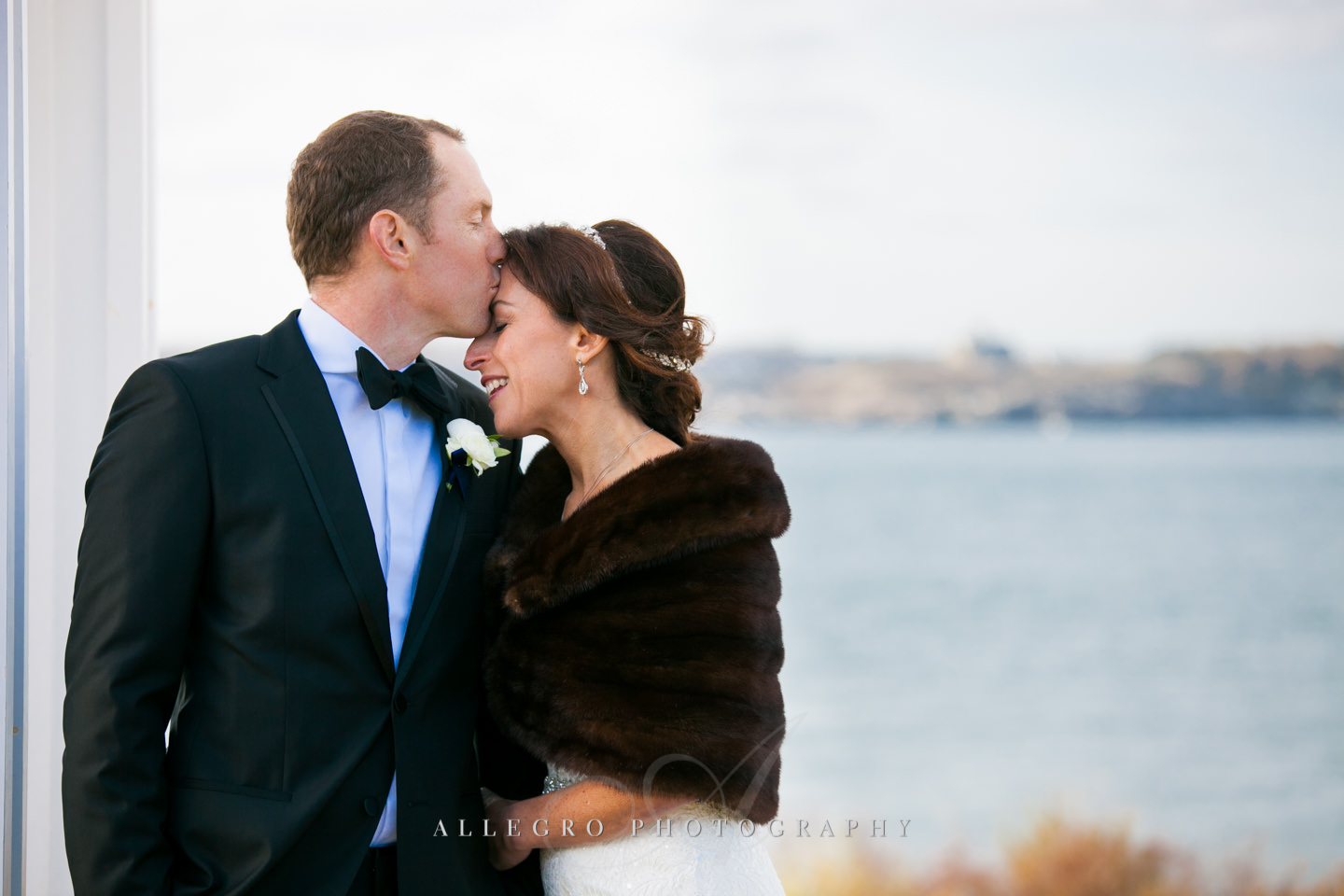 nuzzling bride and groom -photo by Allegro Photography