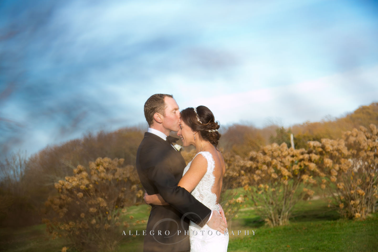 kiss on the forehead -photo by Allegro Photography