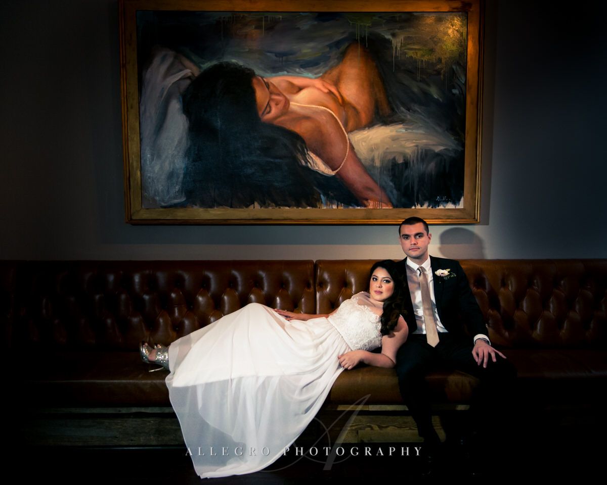 bride and groom painting portrait at high ball lounge hotel nine zero -photo by Allegro Photography