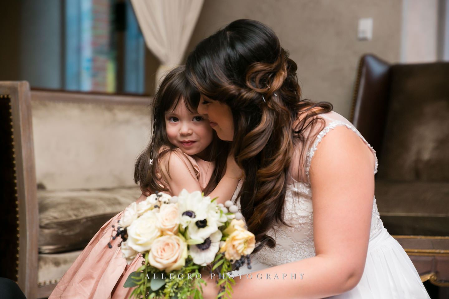 snuggles with the flower girl -photo by Allegro Photography