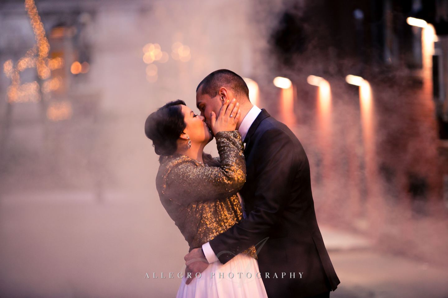 smokey bride and groom kiss in downtown boston -photo by Allegro Photography
