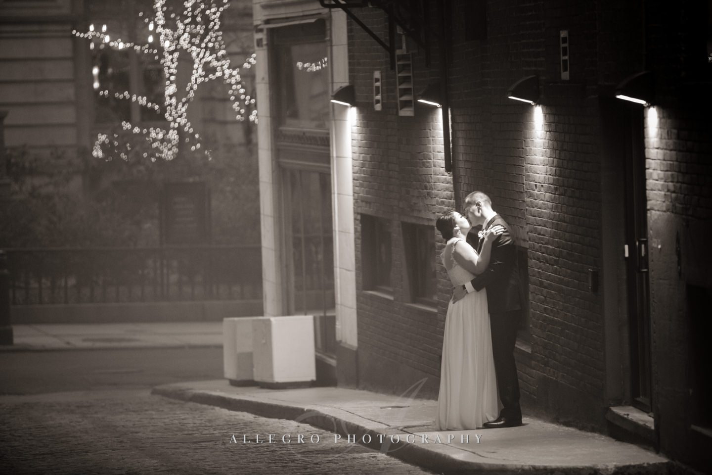 evening winter wedding bride and groom smokey kiss -photo by Allegro Photography