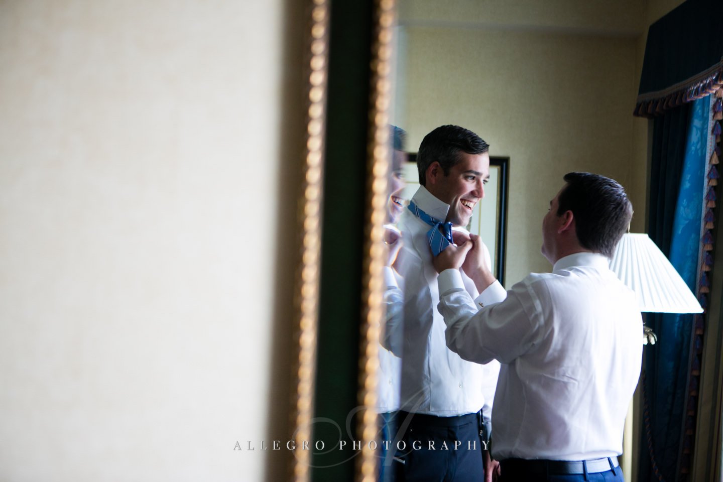 groom with bow tie - tieing it