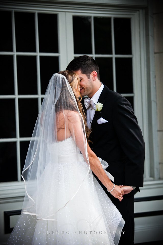 bride and groom kiss - photo by Allegro Photography