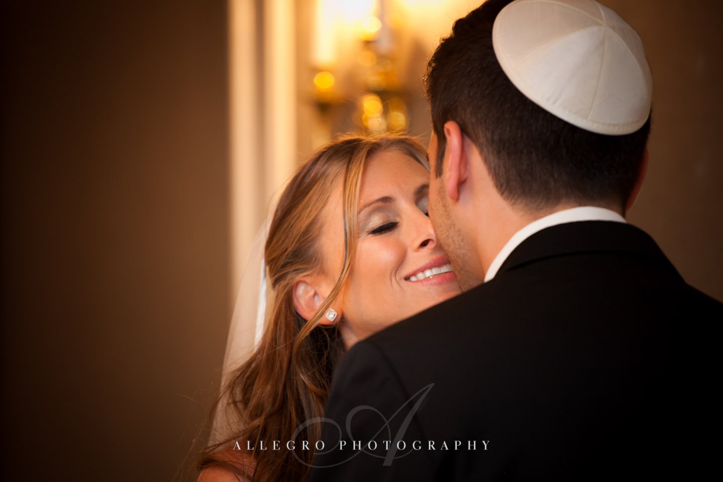 a sweet kiss post ketubah signing fairmont- copley plaza jewish wedding- photo by allegro photography