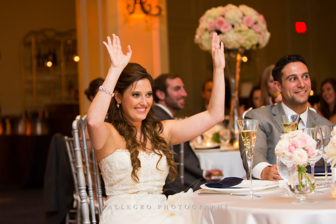 bride celebrating at the boston harbor hotel - photo by allegro photography