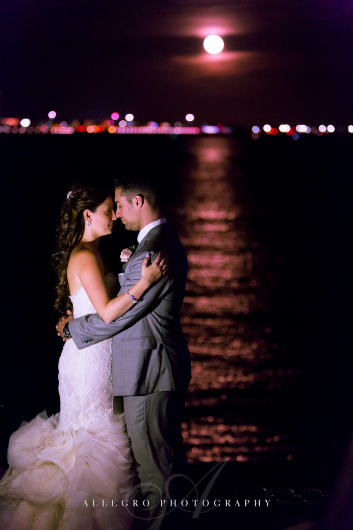 nighttime wedding portrait on the boston harbor - photo by allegro photography
