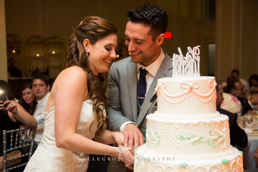 cutting the cake at the boston harbor hotel - photo by allegro photography