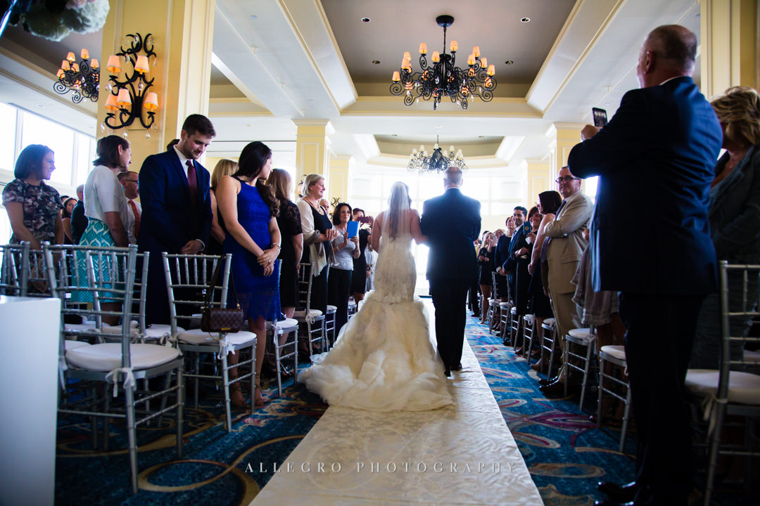 walking down the aisle at the boston harbor hotel - photo by allegro photography