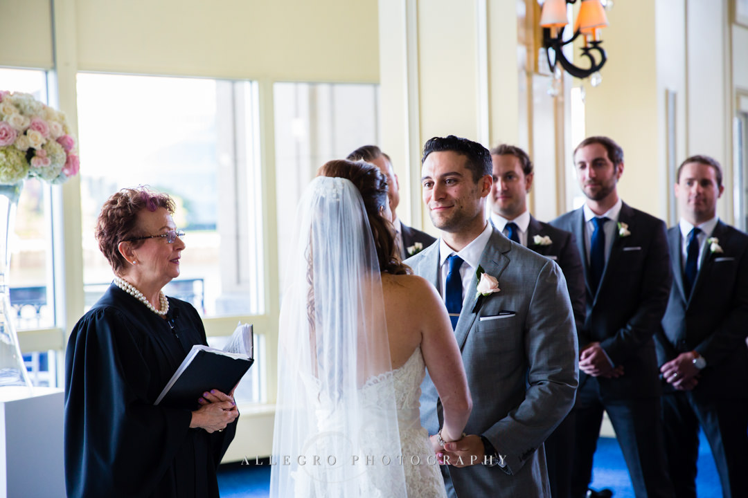 saying vows at the boston harbor hotel - photo by allegro photography
