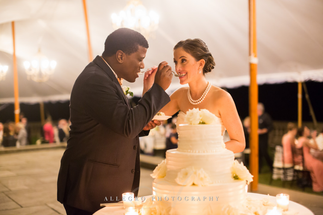 first bite of the wedding cake at crane estate - photo by allegro photography