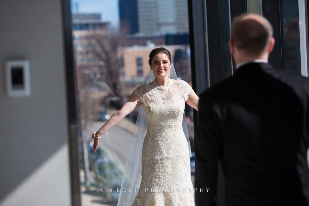 grooms first look at the hotel commonwealth boston - photo by allegro photography