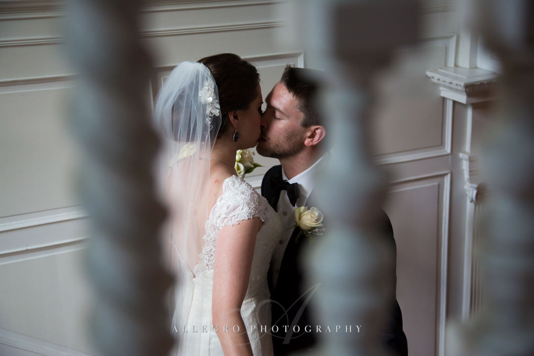 sneaky wedding kiss at the pierce house - photo by allegro photography