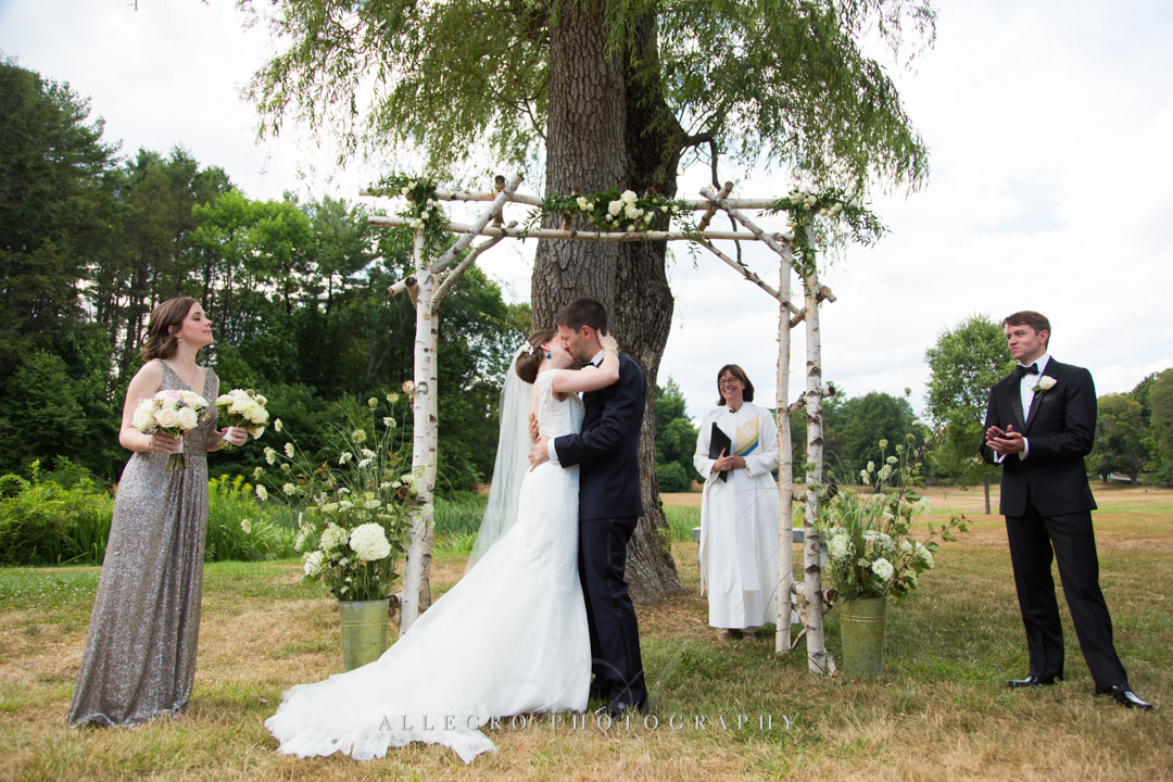 kissing the bride at the pierce house - photo by allegro photography