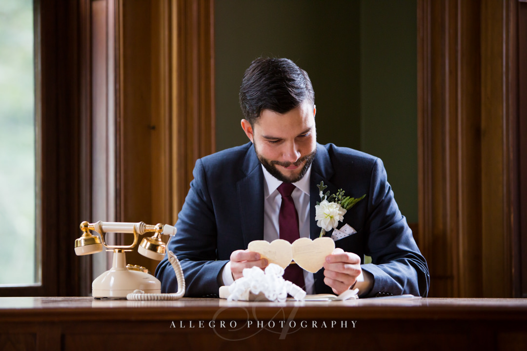 groom reading wedding day love letter boston - photo by allegro photography