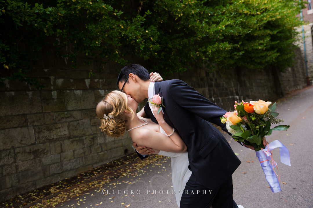 surprise wedding kiss at wellesley college - photo by allegro photography
