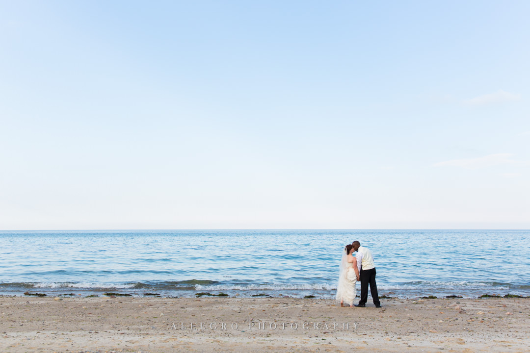 beach wedding first kiss - photo by allegro photography