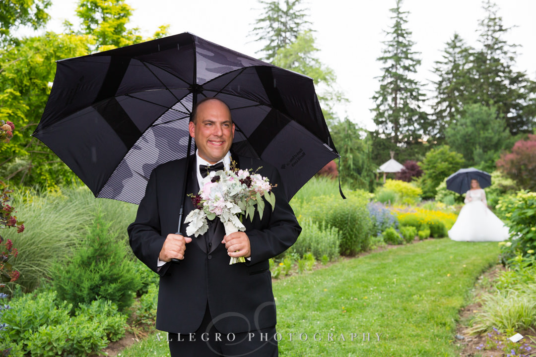 Bride and groom first look on rainy day | Allegro Photography