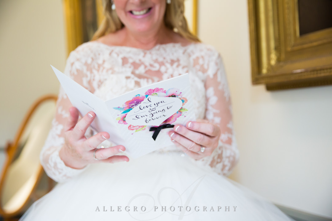Bride to be reading groom's card | Allegro Photography