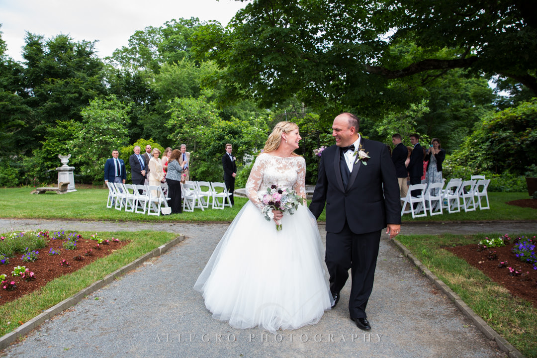 Newlyweds walk down the aisle | Allegro Photography
