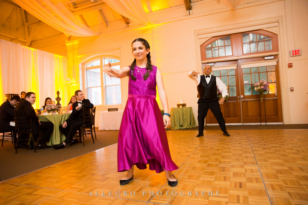 Groom and daughter perform silly dance at wedding | Allegro Photography