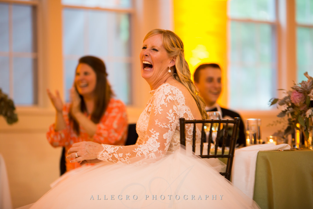 Bride laughs seeing her groom on dance floor | Allegro Photography