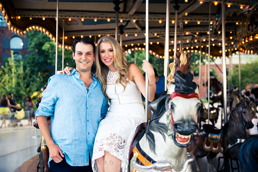 Engaged couple on merry-go-round in NYC | Allegro Photography