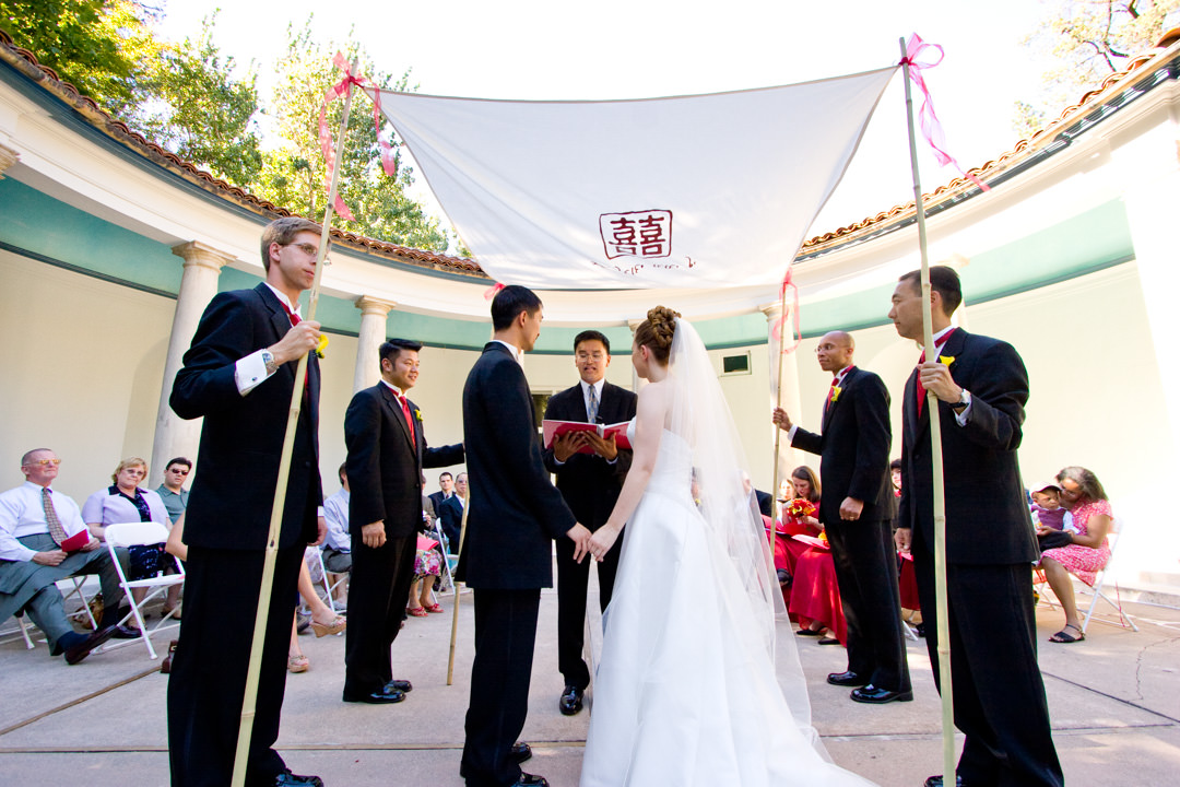 Bride and groom marry under Chinese chuppah