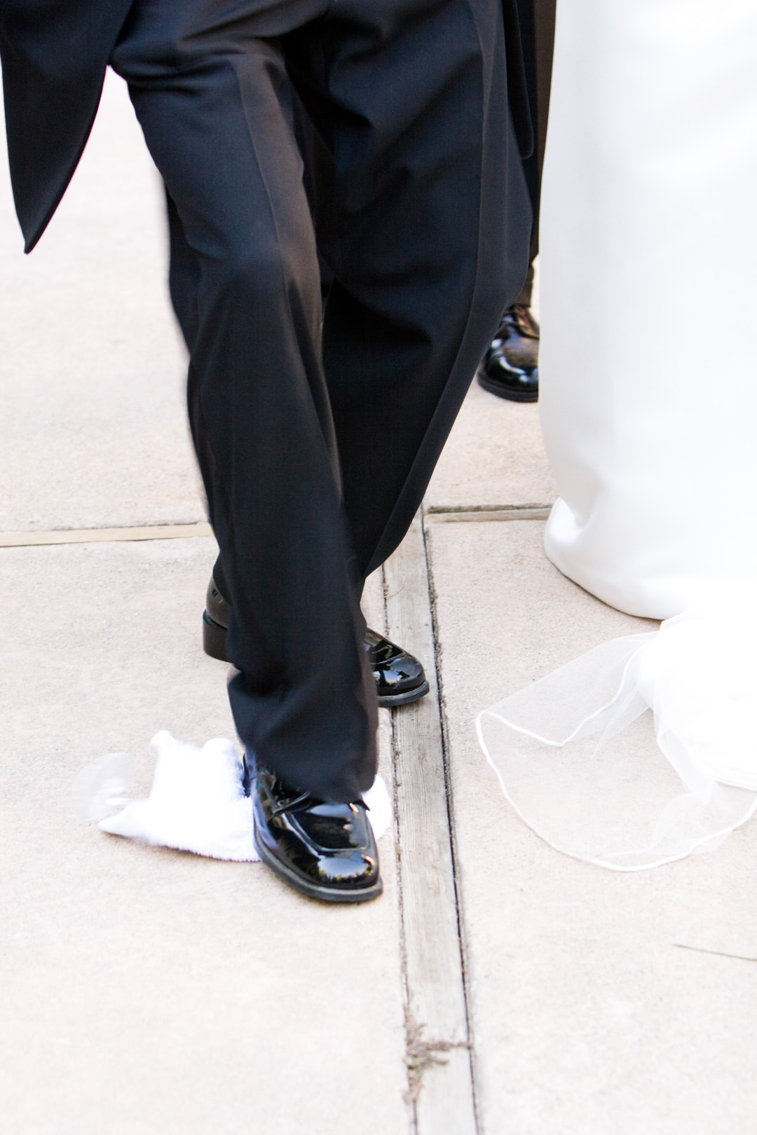 Groom stomps the glass at wedding