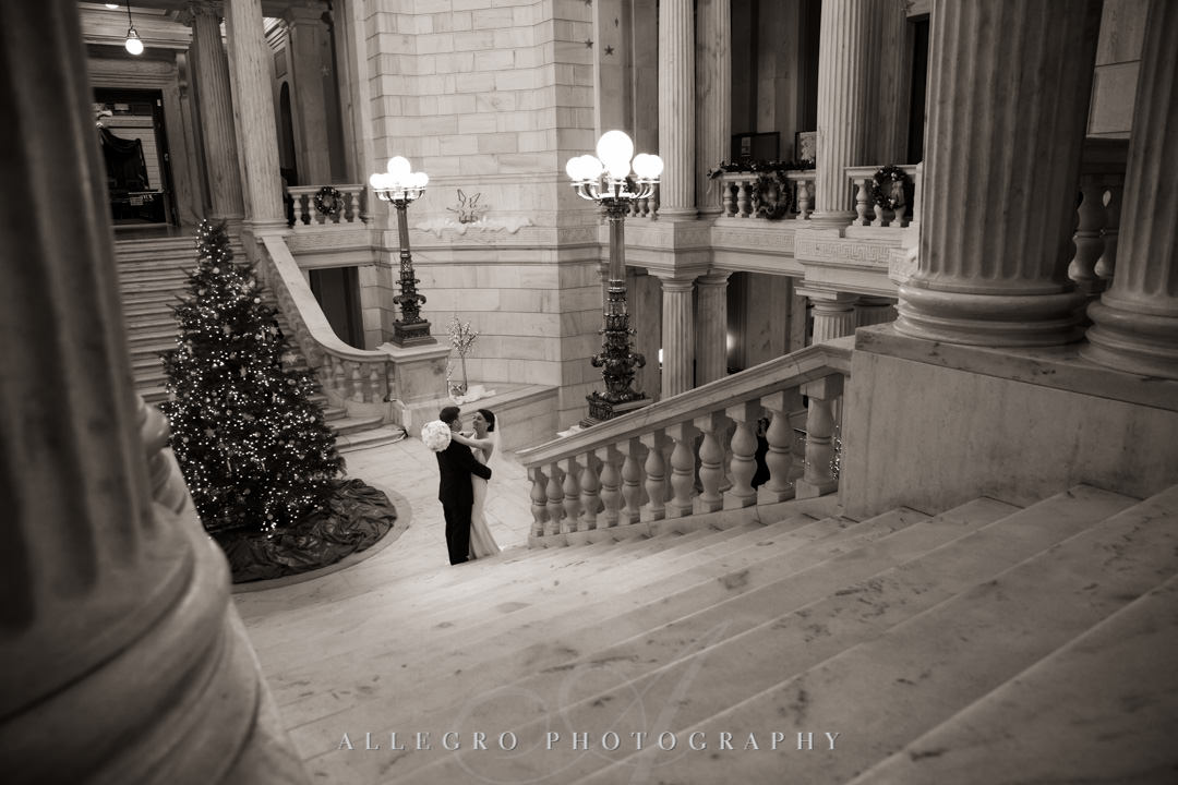 rhode island state house at christmas- Bride and groom embrace before wedding