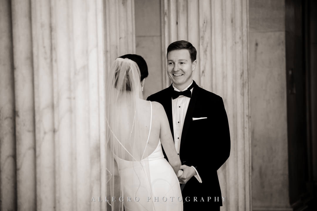 Bride and groom smile at each other before wedding