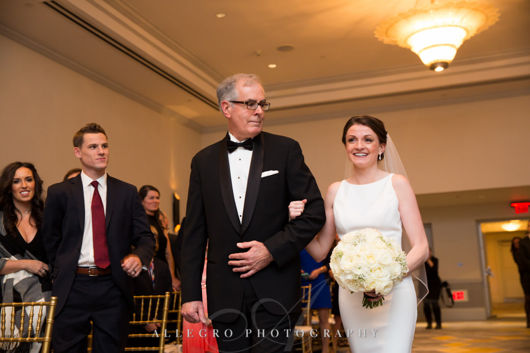 Bride is walked down the aisle by her father