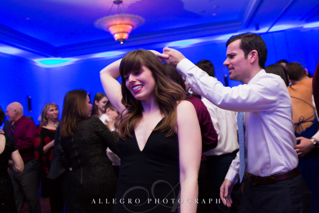Wedding guests twirl on dance floor