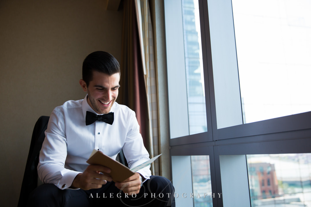 Groom reads card from bride