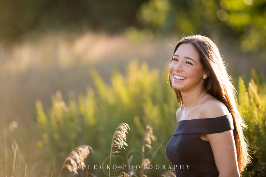 Teenage girl smiling in a field
