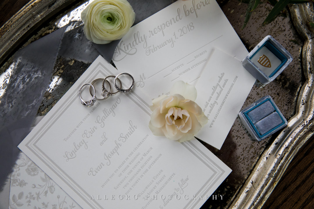 Wedding invitations, flowers, and wedding bands