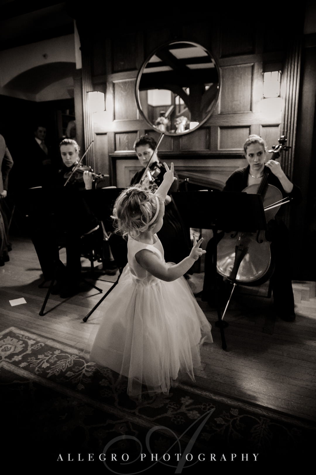 Flower girl dances with Arreaux Strings band