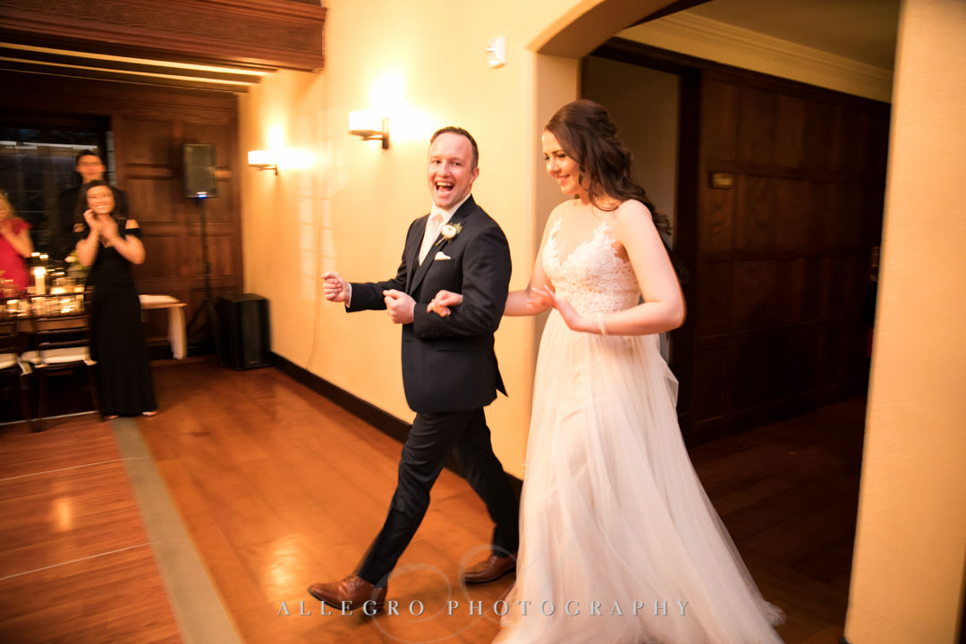 Bride and groom enters reception room together