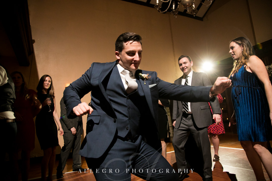 Groomsman dances wildly at wedding