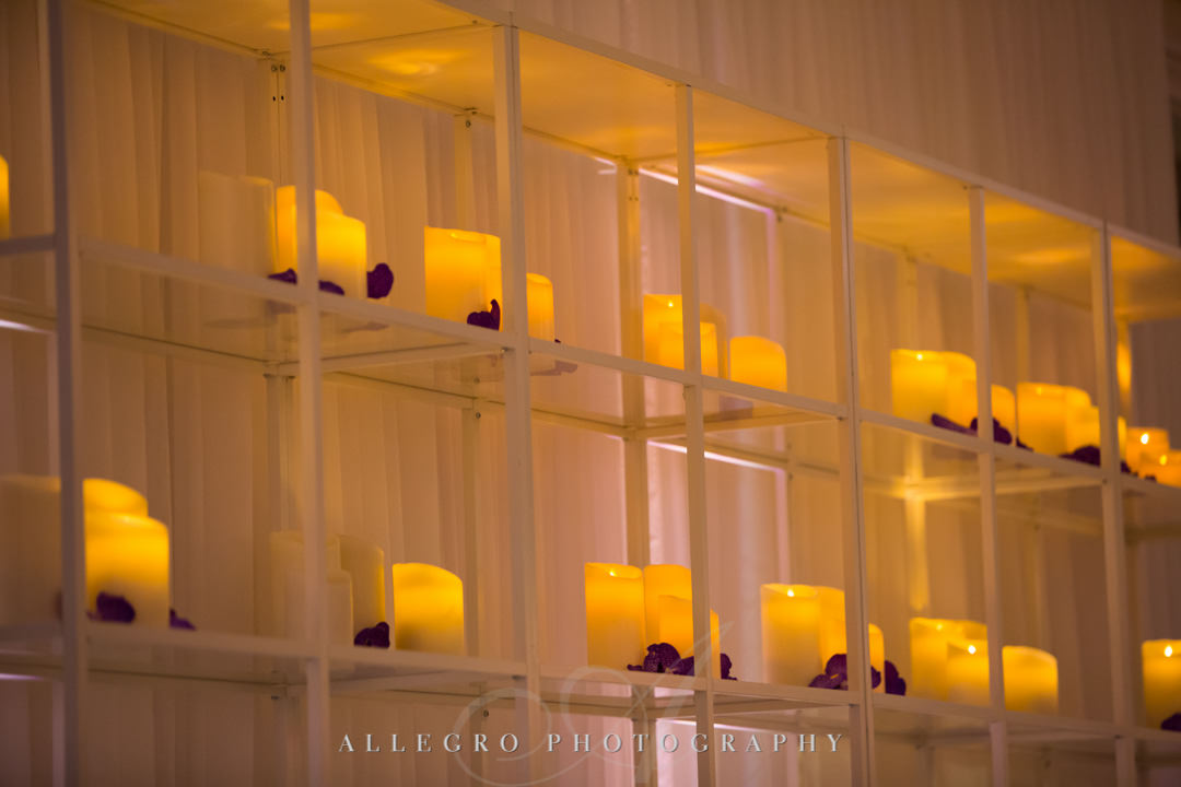Candles lining shelves | Allegro Photography