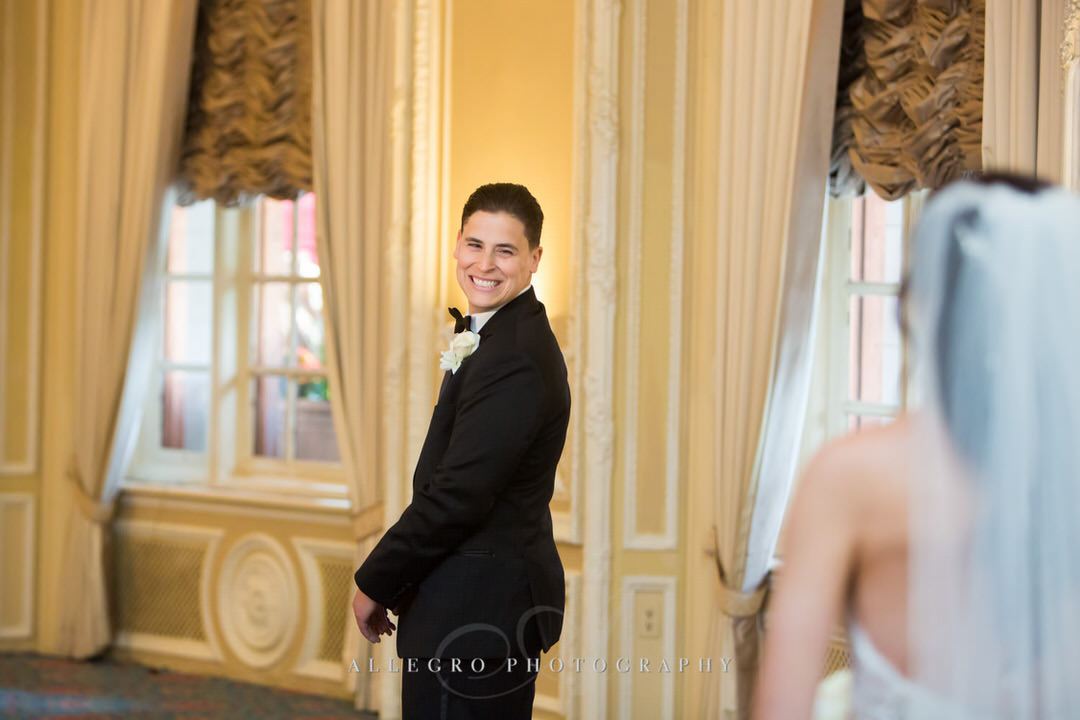 groom smiles as he sees bride for first look
