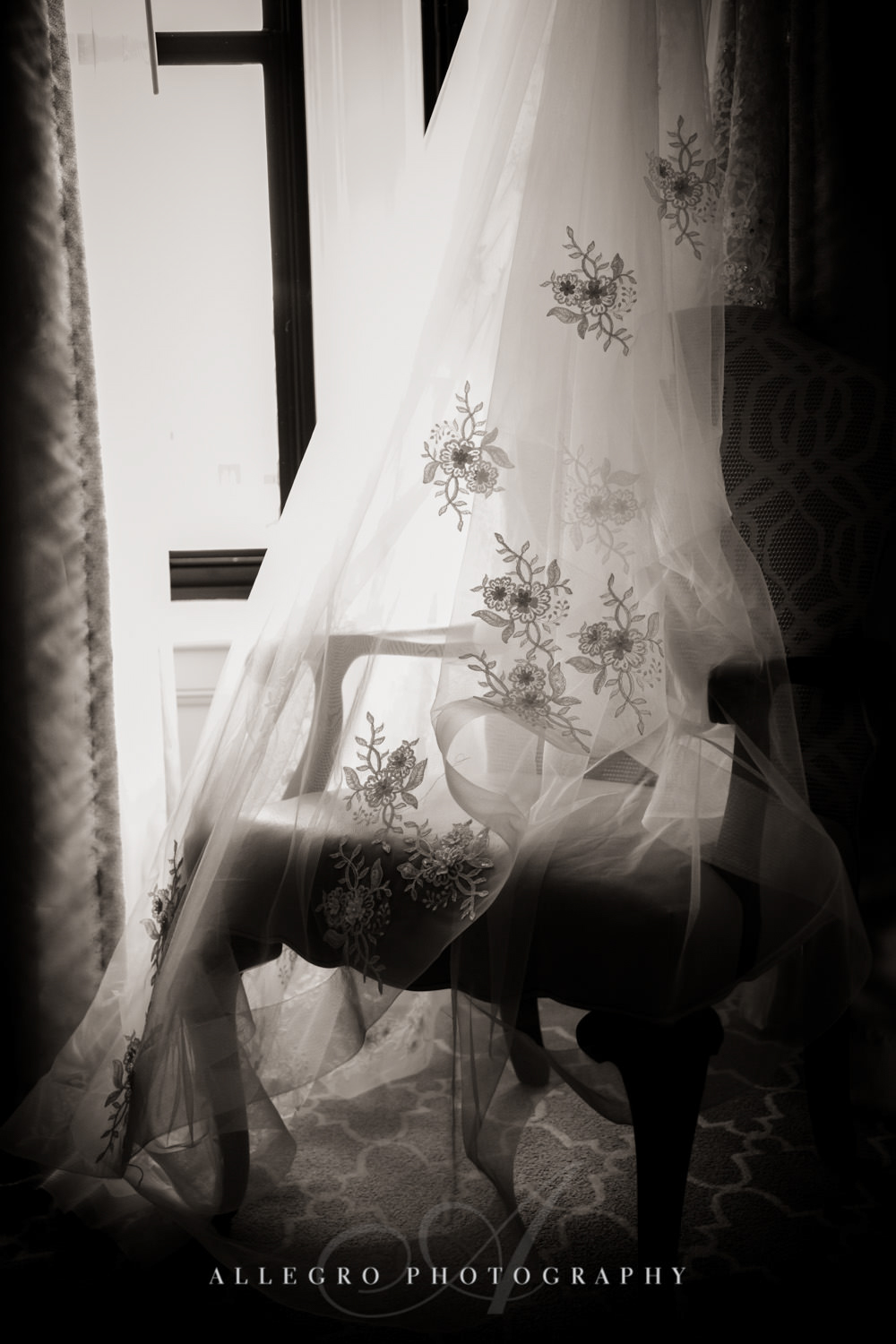 brides gown and veil draped in black and white