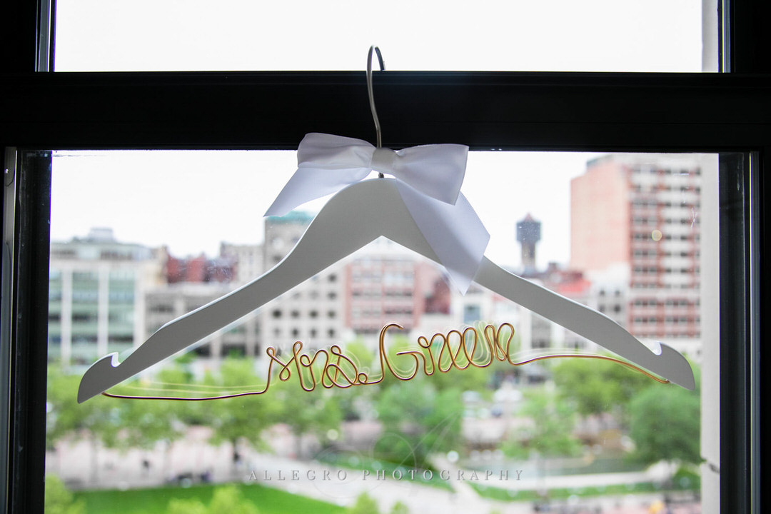 hanger for the dress says last name of couple