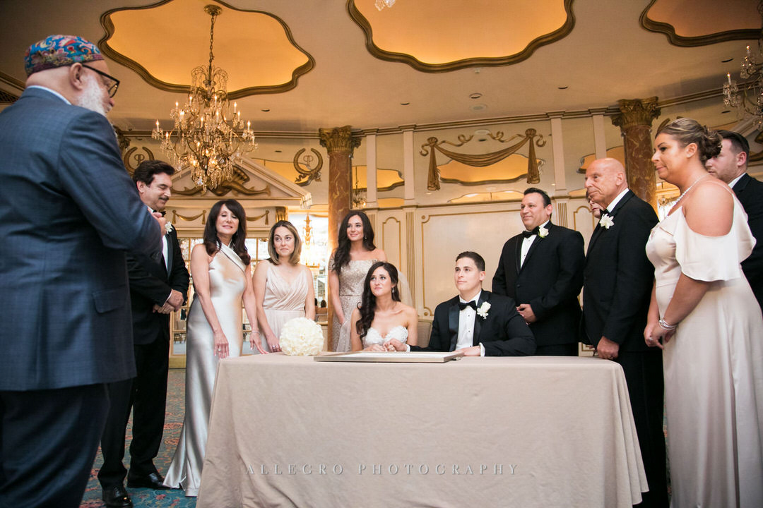 families come together to sign the ketubah